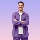 young-male-teacher-standing-with-crossed-arms-wea-2024-10-17-21-44-51-utc.jpg